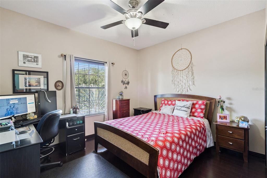 127 Verde Way DeBary, FL 32713 - Photo 35 of 77 a bedroom with a bed and a chandelier