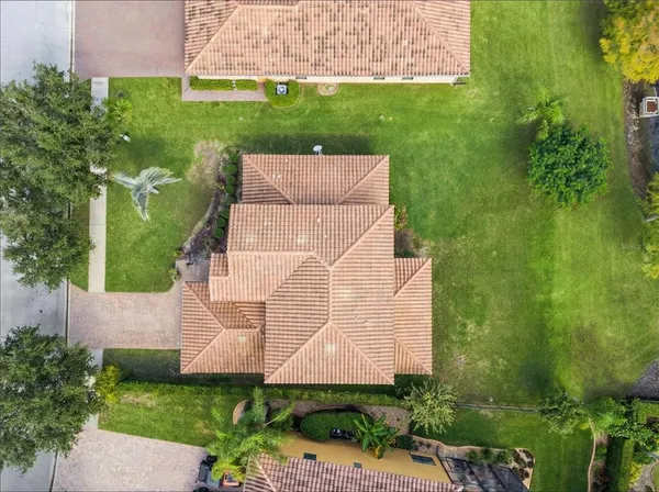 an aerial view of residential houses with outdoor space