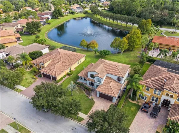 an aerial view of residential house with outdoor space and parking