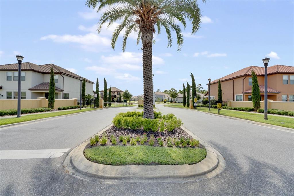 127 Verde Way DeBary, FL 32713 - Photo 53 of 77 a front view of multi story residential apartment building with yard and green space