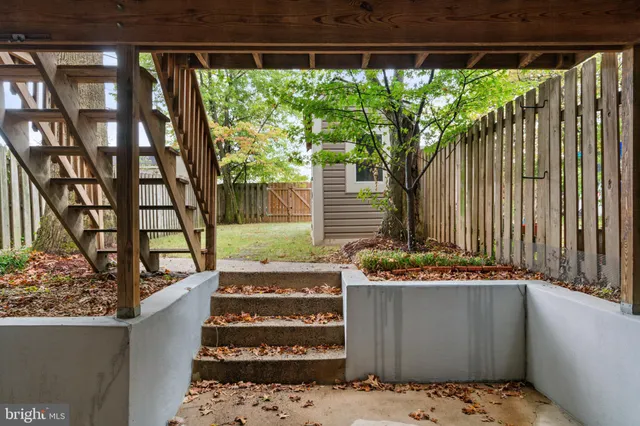 a view of balcony with wooden floor and outdoor seating