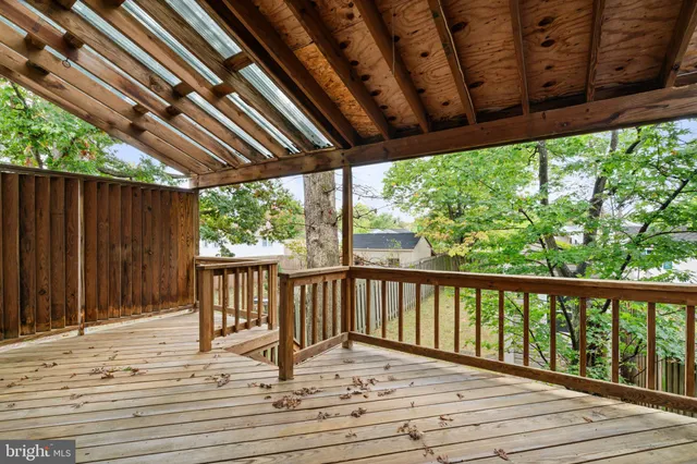 a view of a house with wooden fence