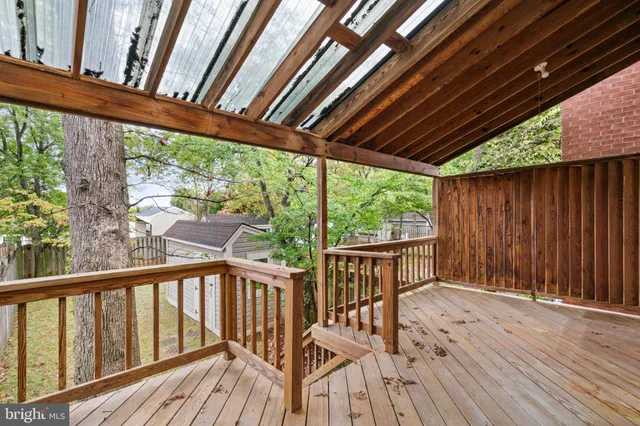 front view of a house with a tree in front