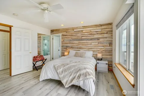 a bathroom with a bathtub toilet and shower
