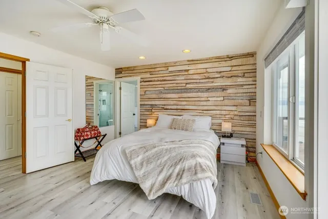 a bathroom with a bathtub toilet and shower