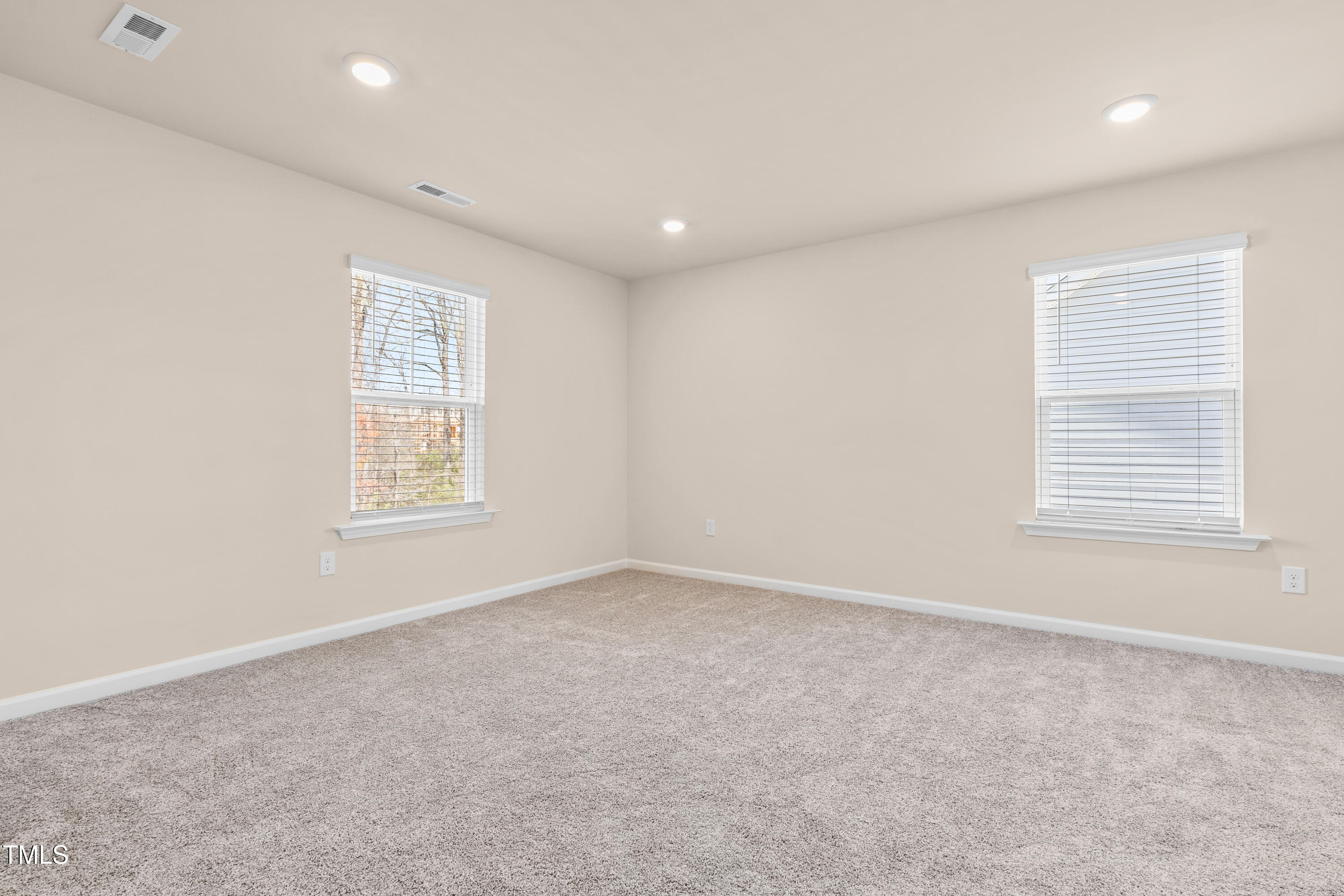 5800 Agrinio Way Raleigh, NC 27603 - Photo 14 of 38 an empty room with windows