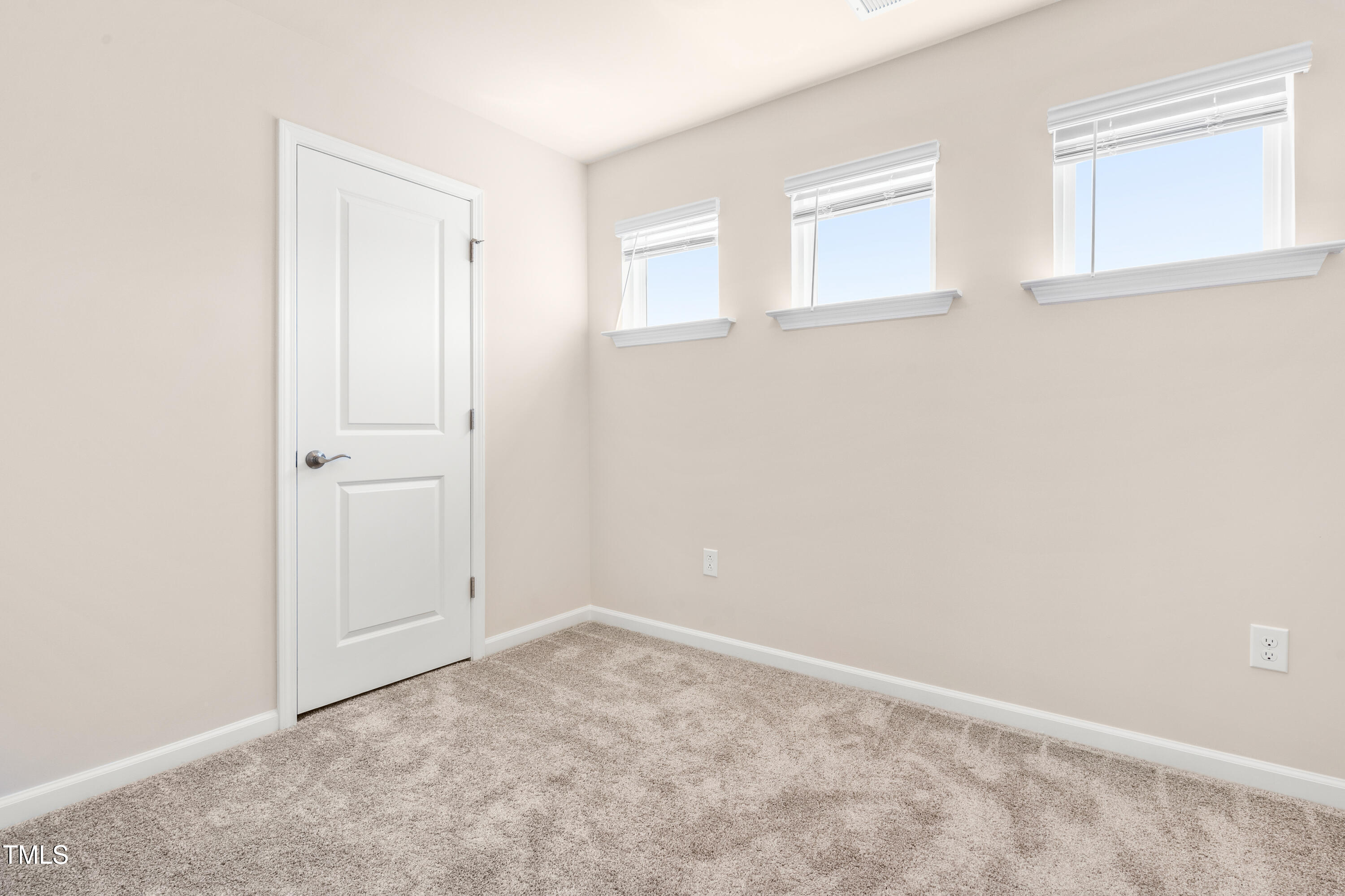 5800 Agrinio Way Raleigh, NC 27603 - Photo 20 of 38 an empty room with windows