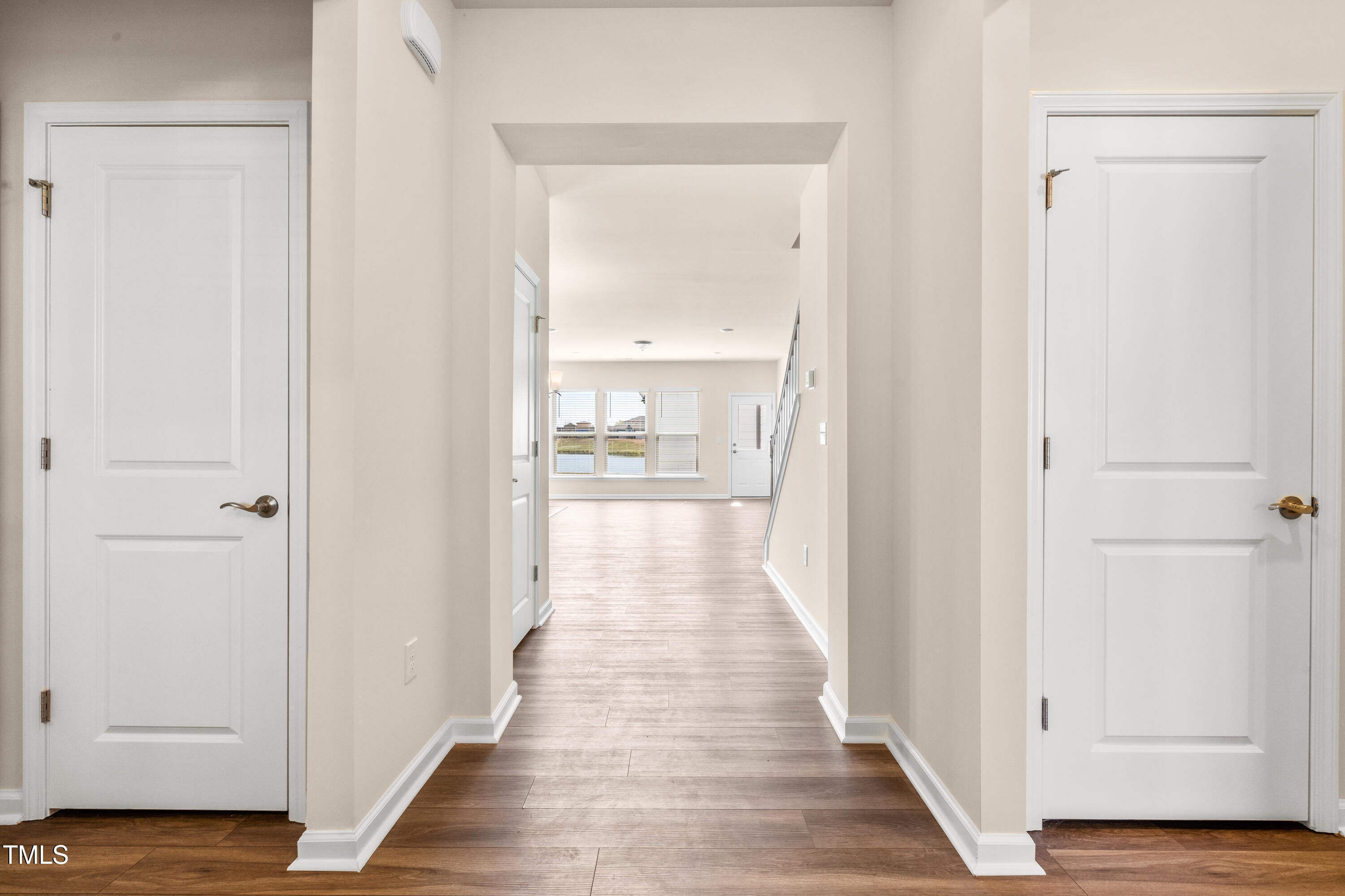 5800 Agrinio Way Raleigh, NC 27603 - Photo 2 of 38 a view of a hallway with wooden floor