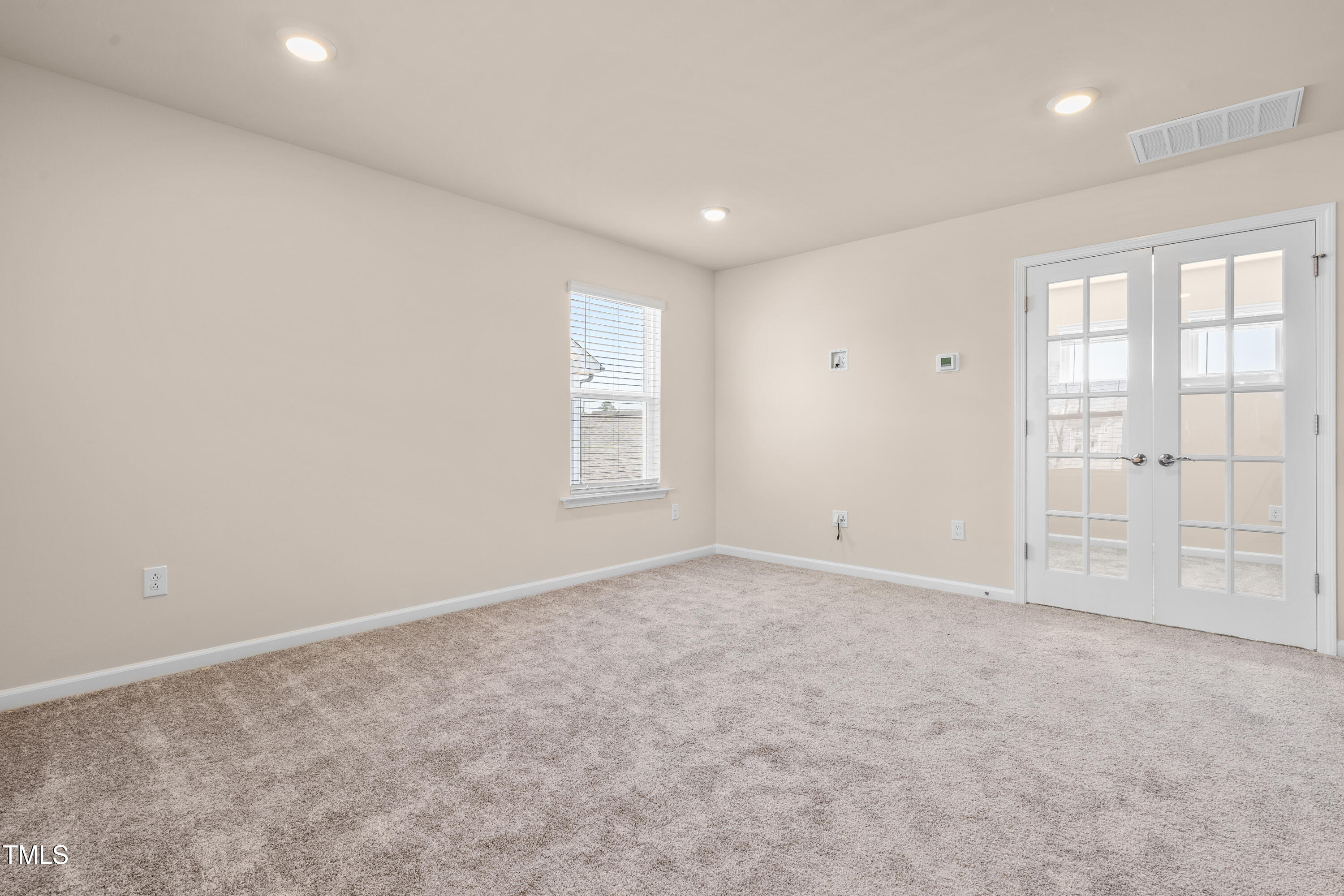 5800 Agrinio Way Raleigh, NC 27603 - Photo 21 of 38 an empty room with windows