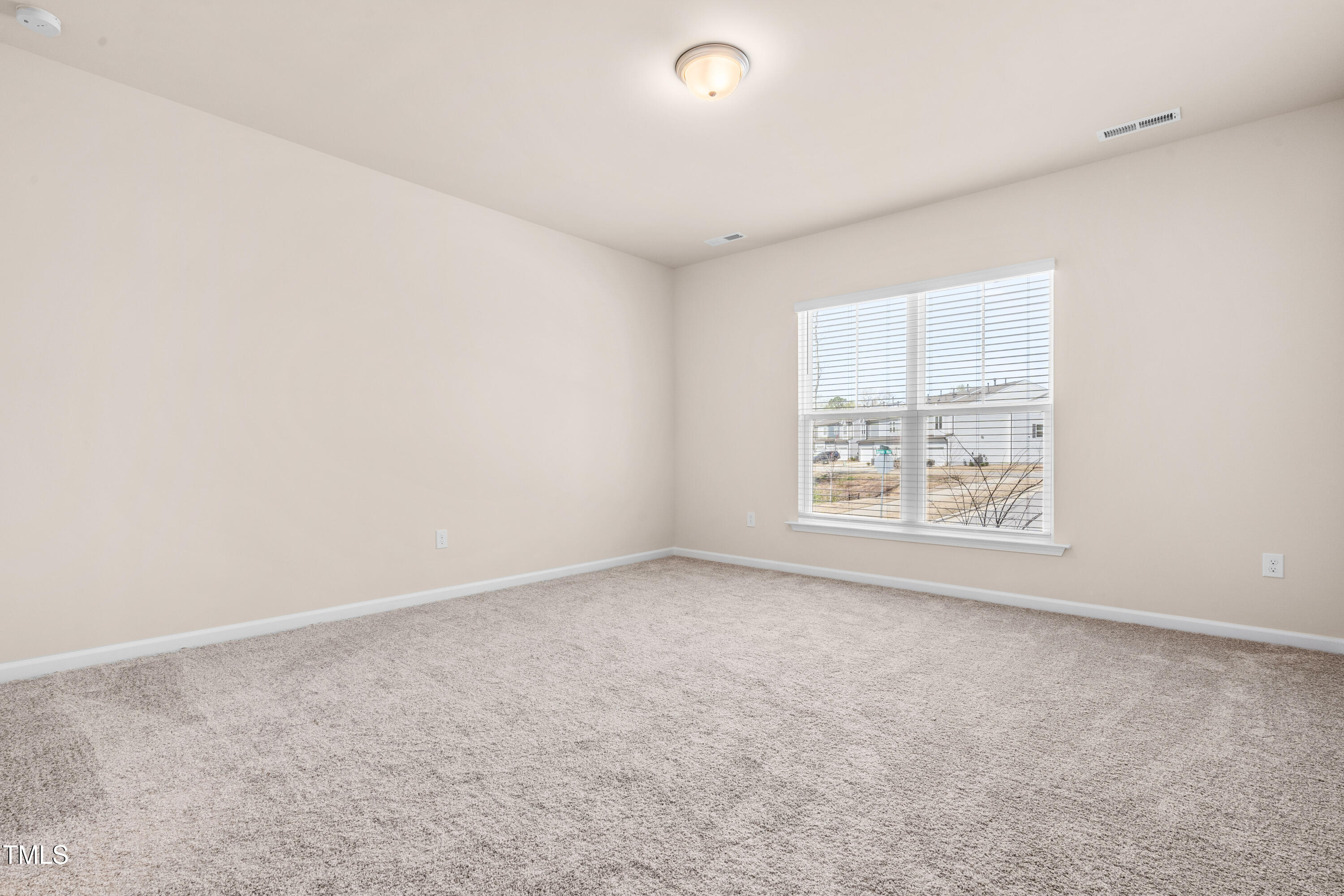 5800 Agrinio Way Raleigh, NC 27603 - Photo 22 of 38 an empty room with a window