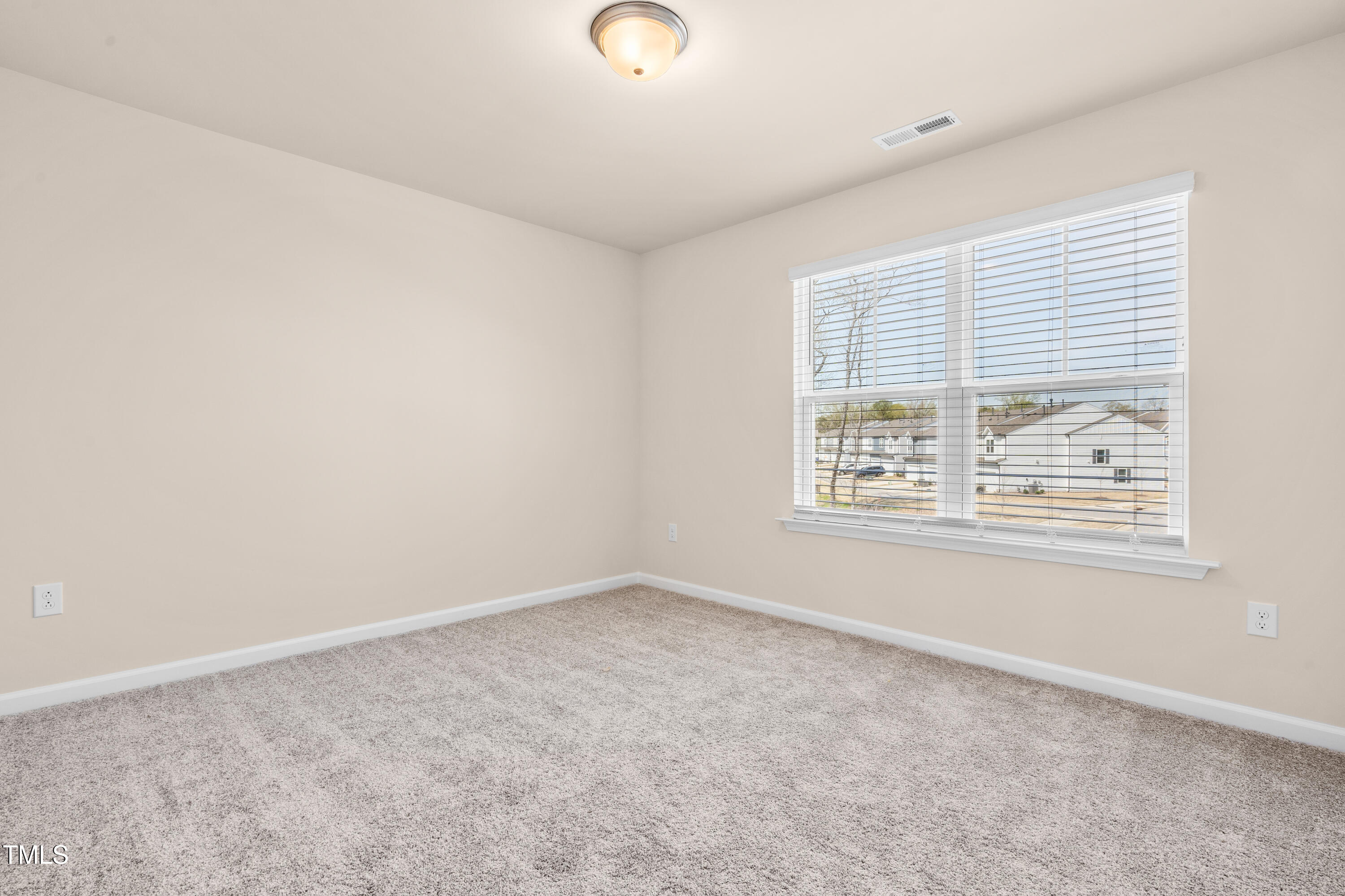 5800 Agrinio Way Raleigh, NC 27603 - Photo 23 of 38 an empty room with windows