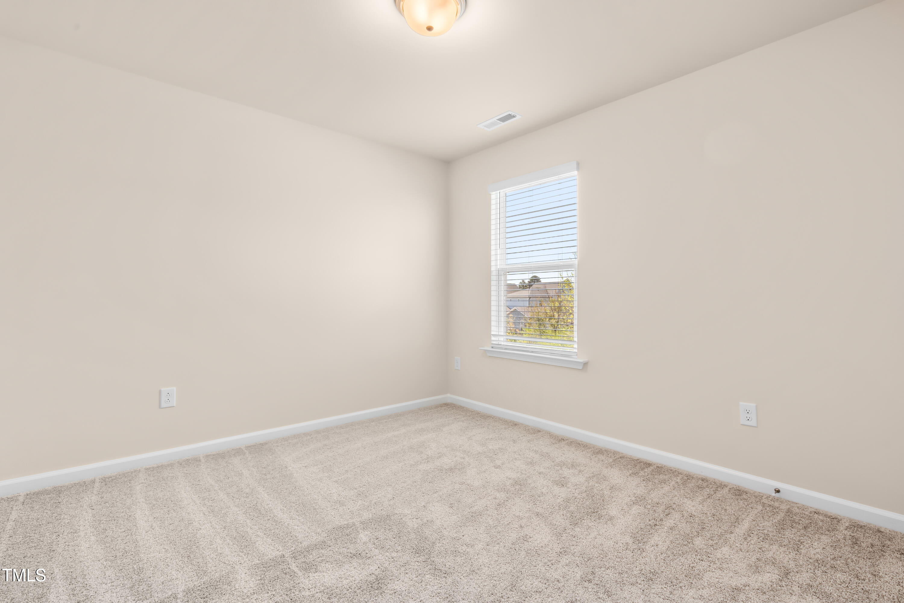 5800 Agrinio Way Raleigh, NC 27603 - Photo 24 of 38 an empty room with a window