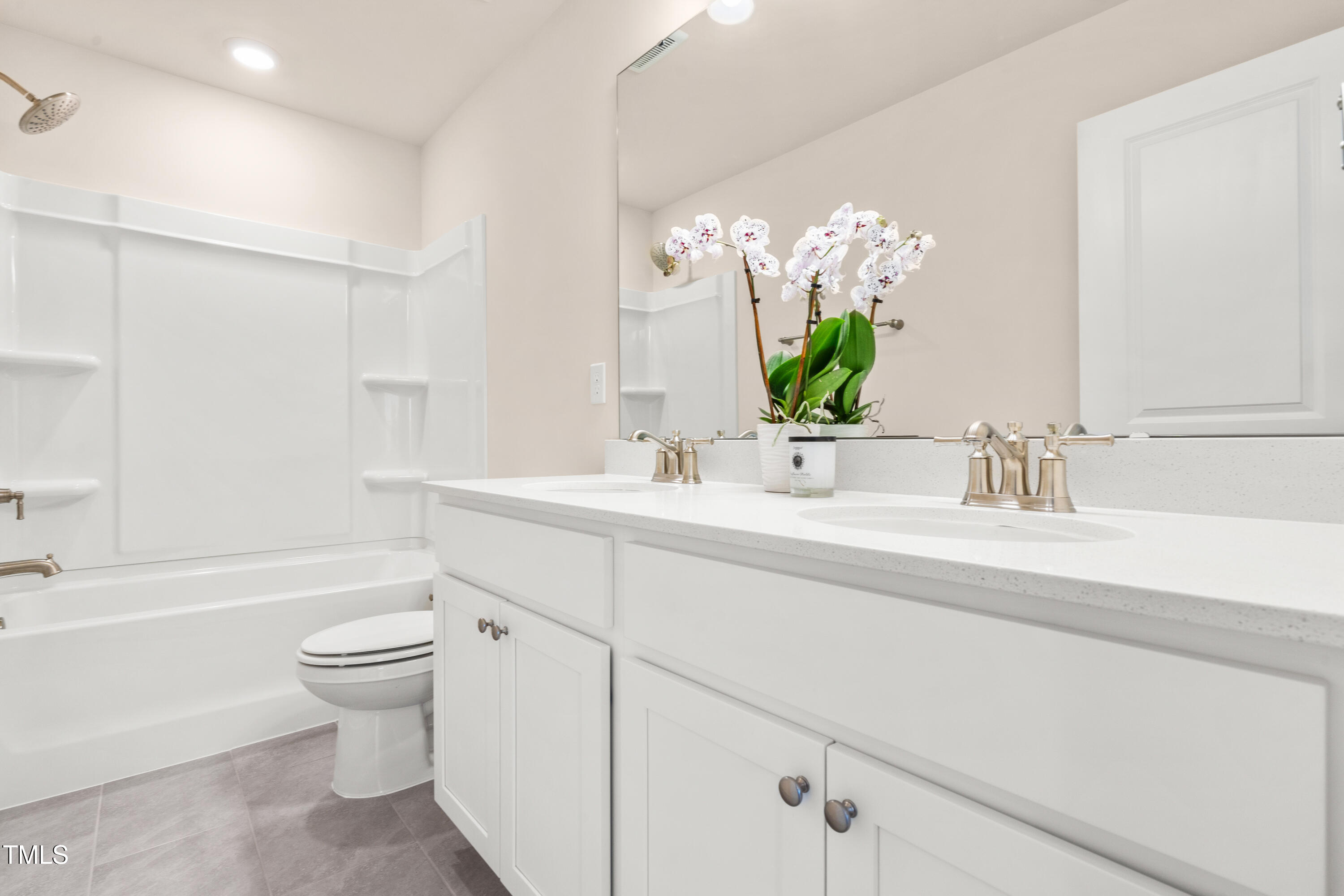 5800 Agrinio Way Raleigh, NC 27603 - Photo 25 of 38 a bathroom with a sink a toilet and a bathtub
