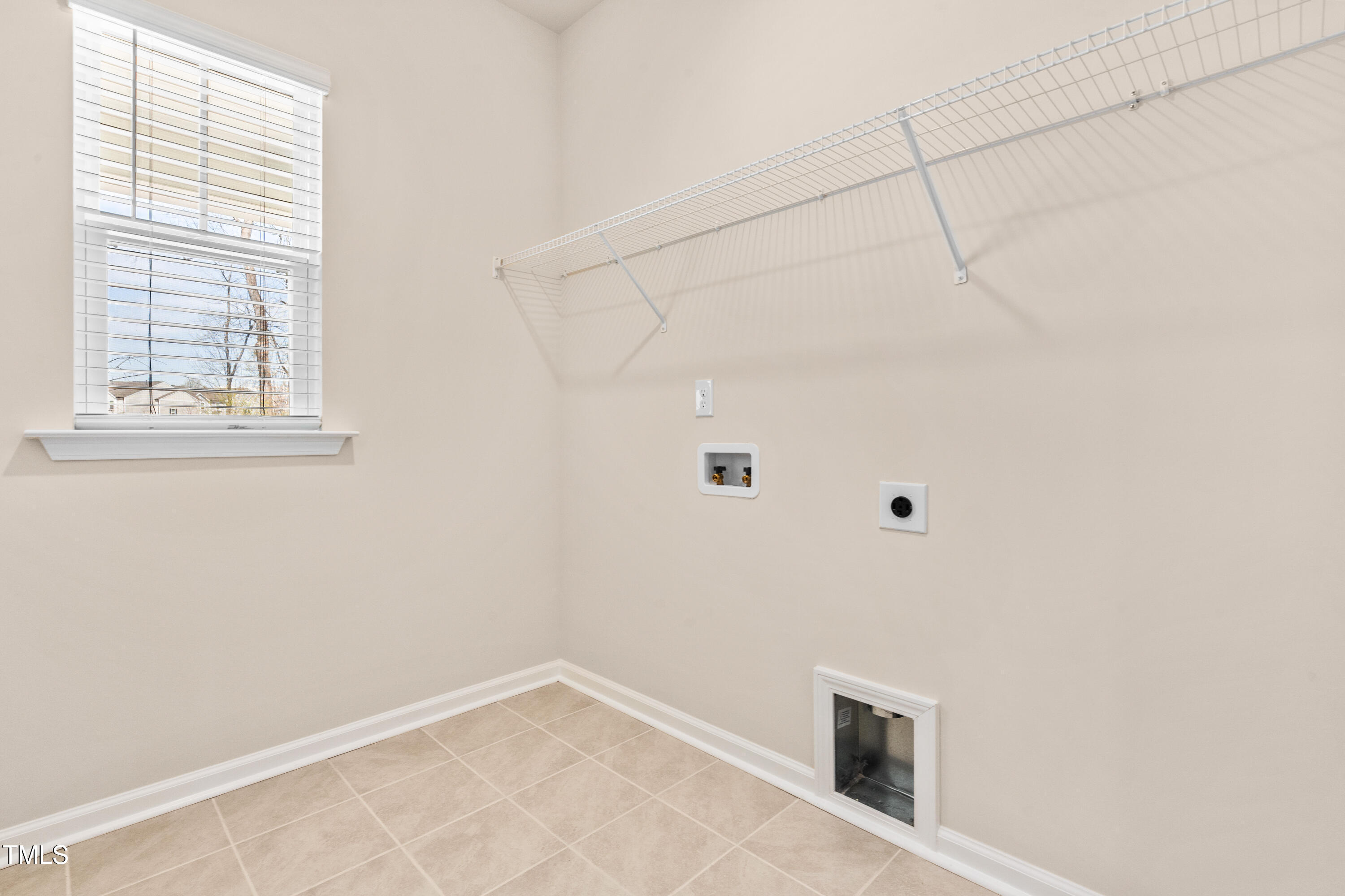 5800 Agrinio Way Raleigh, NC 27603 - Photo 26 of 38 a view of an empty room with a window