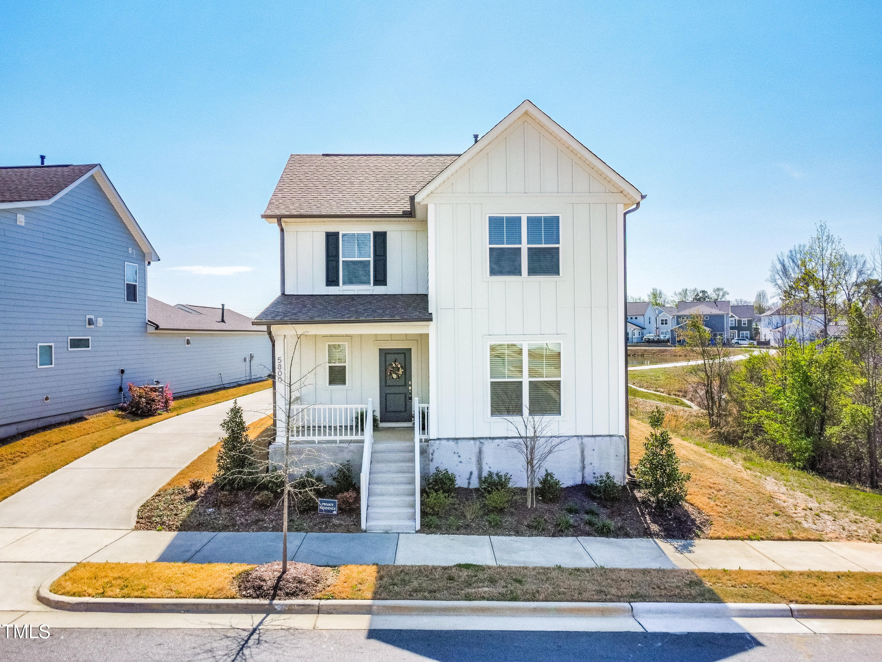 5800 Agrinio Way Raleigh, NC 27603 - Photo 32 of 38 a front view of a house with garden