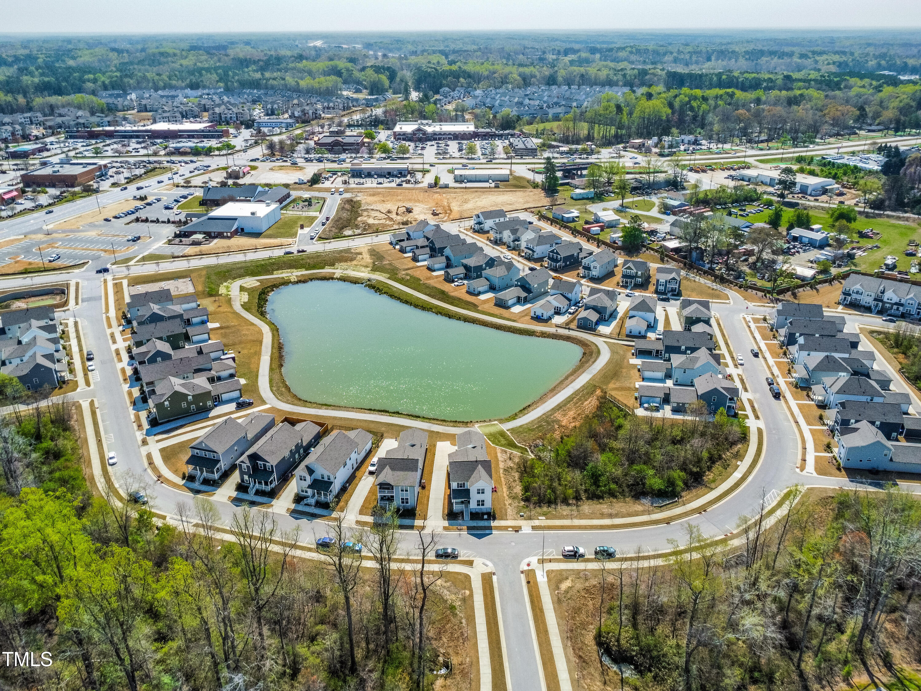 5800 Agrinio Way Raleigh, NC 27603 - Photo 36 of 38 an aerial view of a house with a swimming pool outdoor seating and yard
