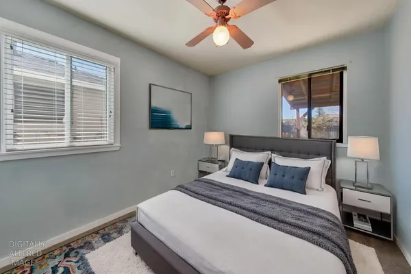 a bedroom with a bed and a window