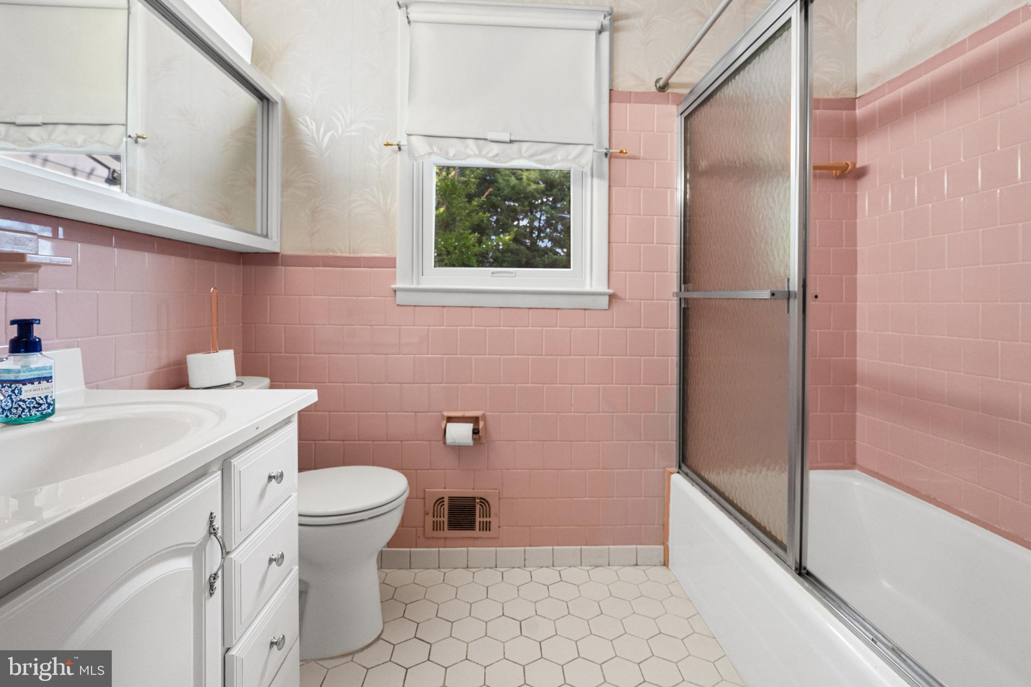 8806 Ashford Road Baltimore, MD 21234 - Photo 13 of 23 a bathroom with a sink toilet and shower
