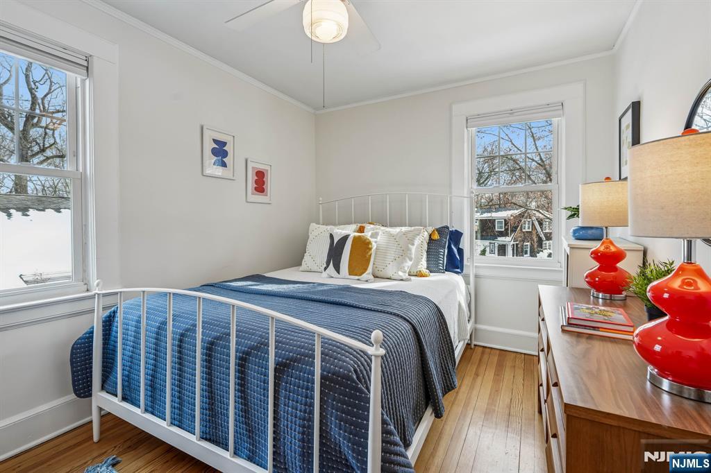 31 Nassau Road Montclair, NJ 07043 - Photo 18 of 33 a bedroom with a bed and wooden floor