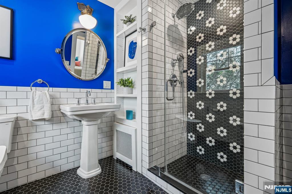 31 Nassau Road Montclair, NJ 07043 - Photo 20 of 33 a bathroom with a sink and a mirror