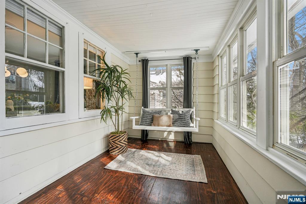 31 Nassau Road Montclair, NJ 07043 - Photo 5 of 33 a room with wooden floor and large windows