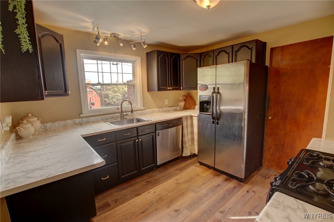 28 Cedar Road Cheektowaga, NY 14215 - Photo 11 of 43 Galley style kitchen new easy clean flooring.