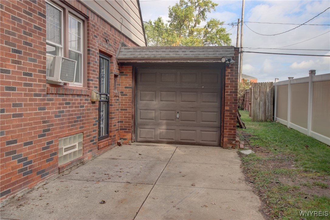 28 Cedar Road Cheektowaga, NY 14215 - Photo 4 of 43 One car attached garage leads to the fully fenced