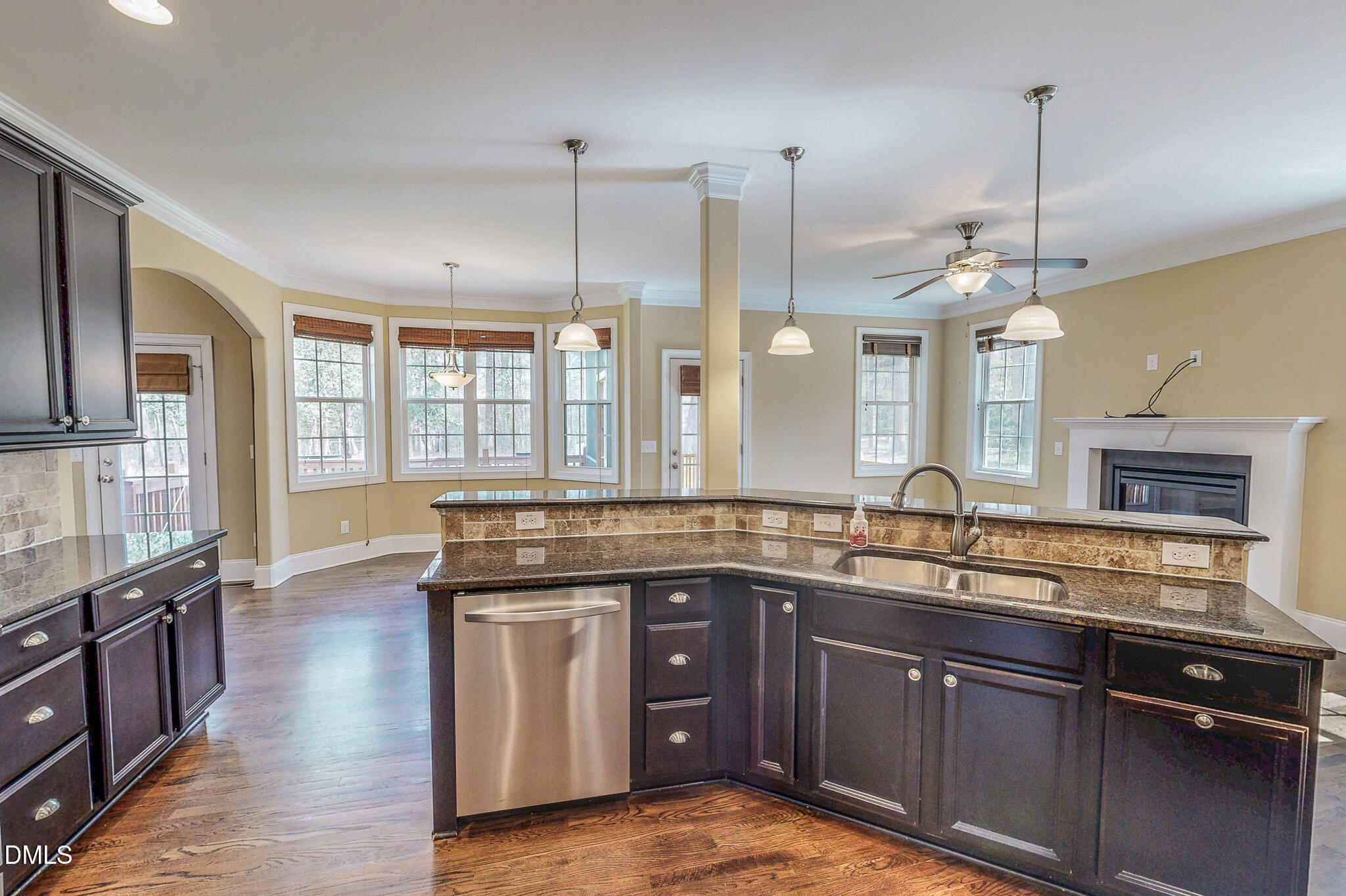 128 Cardens Cove Road Timberlake, NC 27583 - Photo 7 of 54 a kitchen with stainless steel appliances granite countertop a sink a stove and a wooden floors