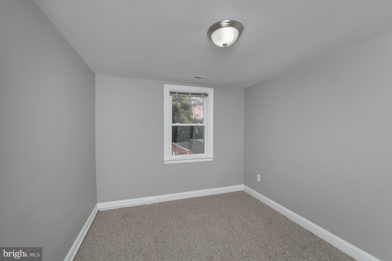 3924 Yolando Road Baltimore, MD 21218 - Photo 16 of 29 an empty room with a window