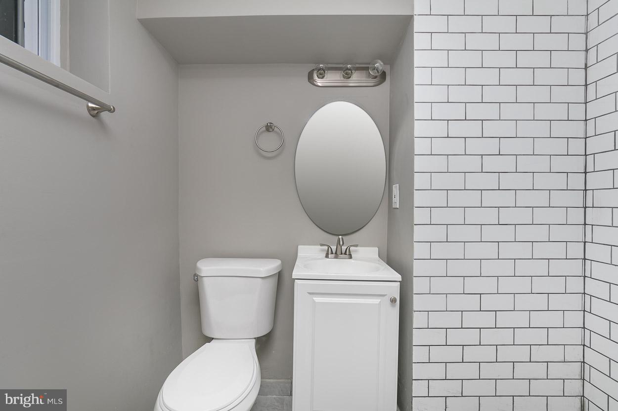 3924 Yolando Road Baltimore, MD 21218 - Photo 25 of 29 a bathroom with a toilet and a sink
