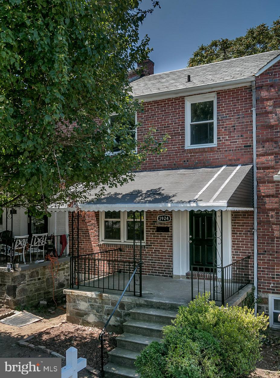 3924 Yolando Road Baltimore, MD 21218 - Photo 28 of 29 a front view of a house with a garden