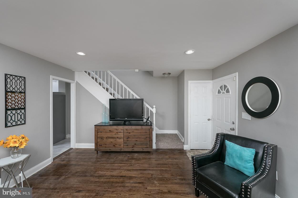 3924 Yolando Road Baltimore, MD 21218 - Photo 10 of 29 a living room with furniture and a flat screen tv
