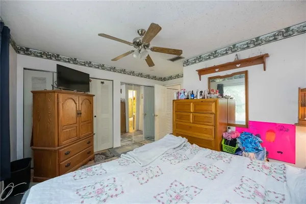 a bedroom with a bed and a dresser