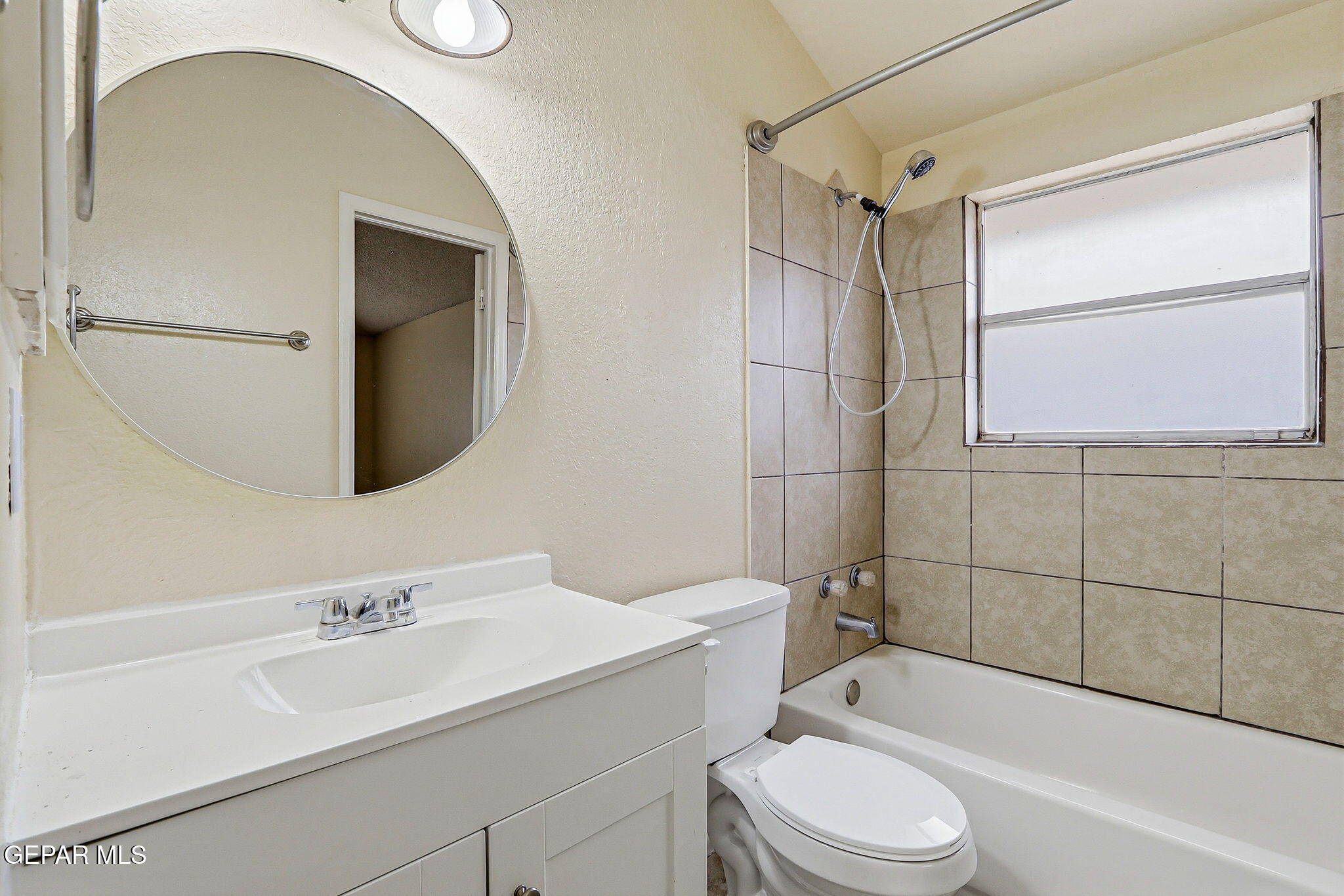 10801 Rhyolite Drive El Paso, TX 79924 - Photo 13 of 23 a bathroom with a sink toilet and shower