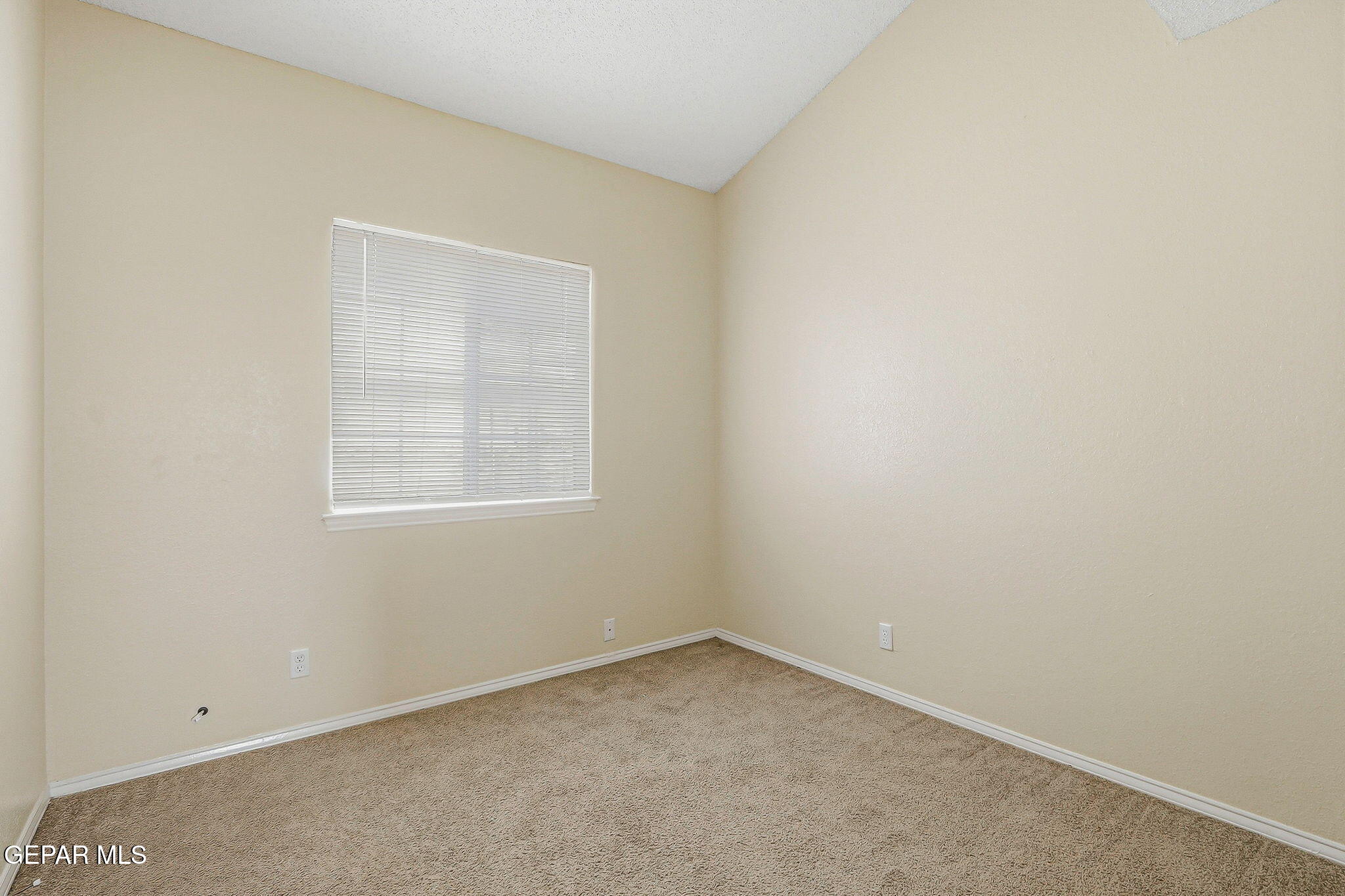 10801 Rhyolite Drive El Paso, TX 79924 - Photo 15 of 23 an empty room with a window