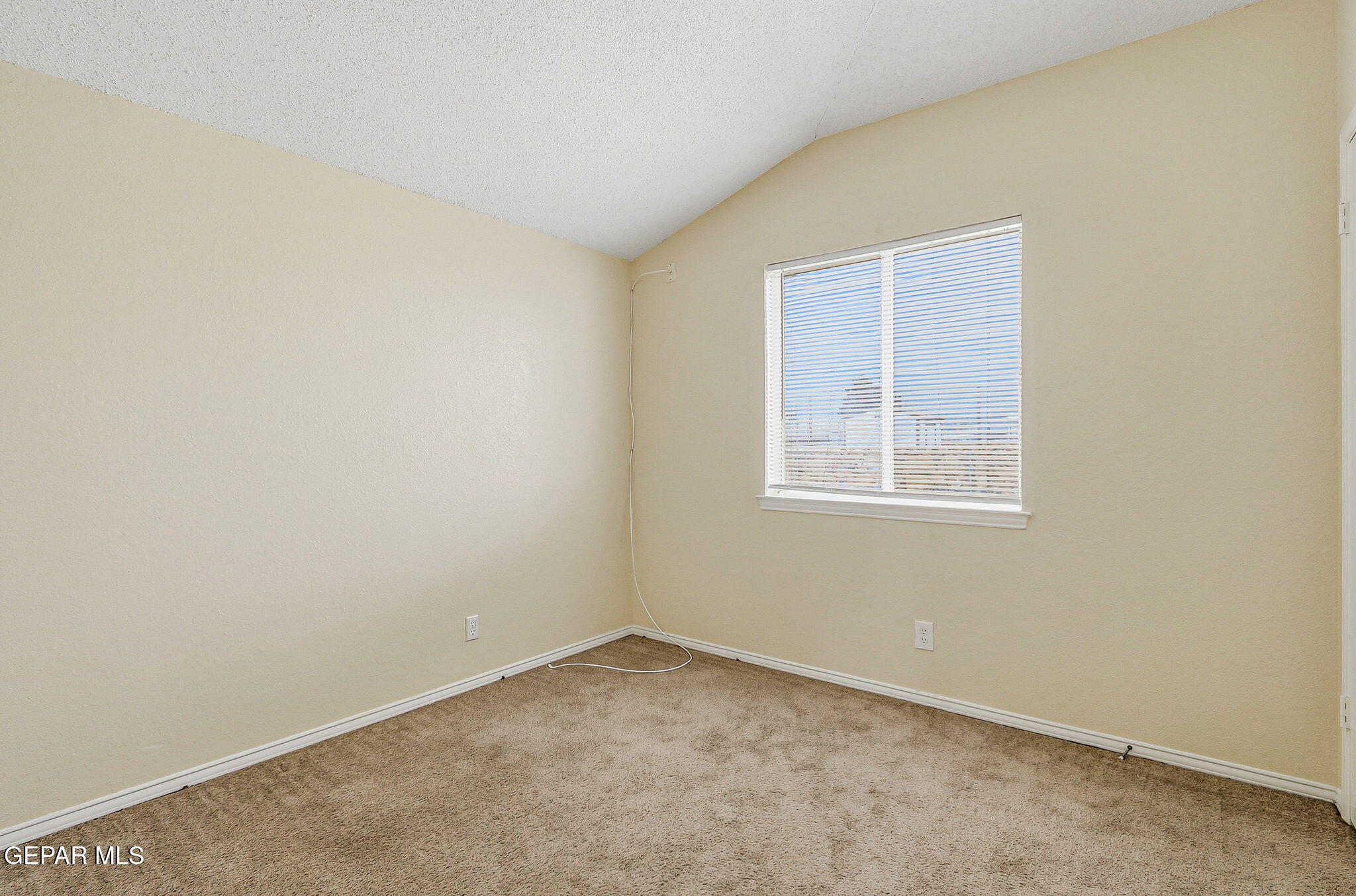10801 Rhyolite Drive El Paso, TX 79924 - Photo 16 of 23 an empty room with a window