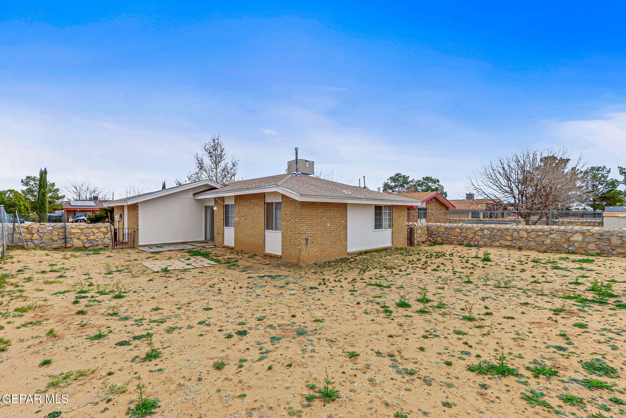 10801 Rhyolite Drive El Paso, TX 79924 - Photo 20 of 23 a yellow and white house with a large window
