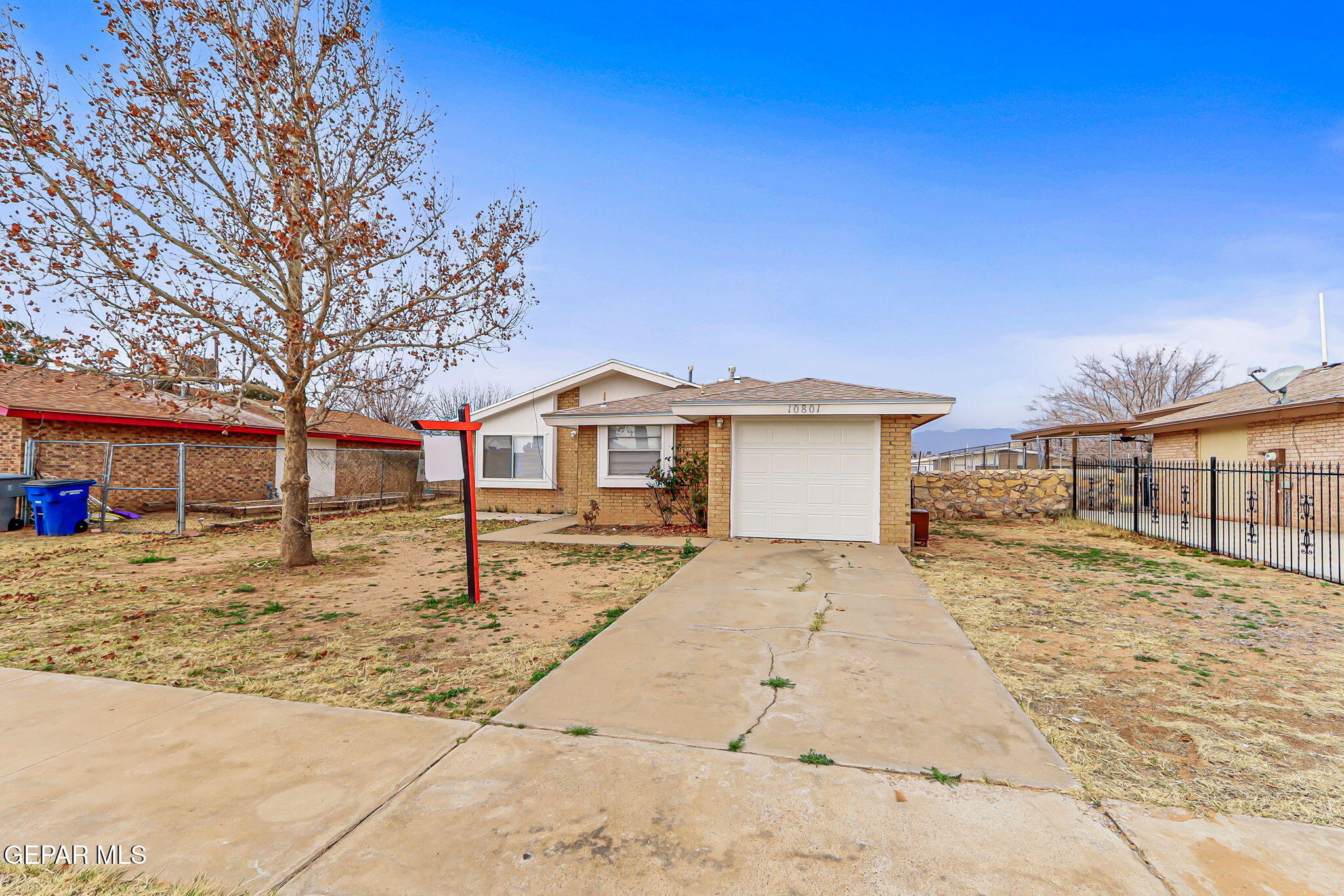 10801 Rhyolite Drive El Paso, TX 79924 - Photo 3 of 23 a front view of a house with a yard
