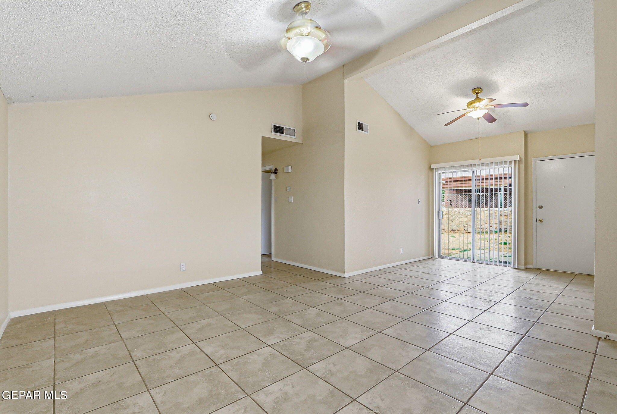 10801 Rhyolite Drive El Paso, TX 79924 - Photo 6 of 23 a view of an empty room with a window