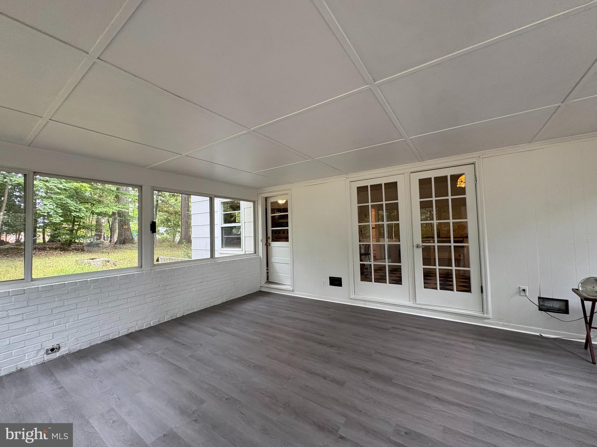 3306 Whitesworth Road Phoenix, MD 21131 - Photo 12 of 31 an empty room with wooden floor and windows