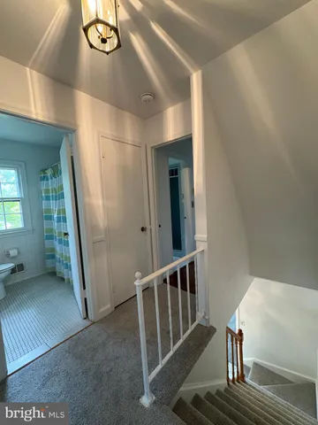 a view of a hallway with windows