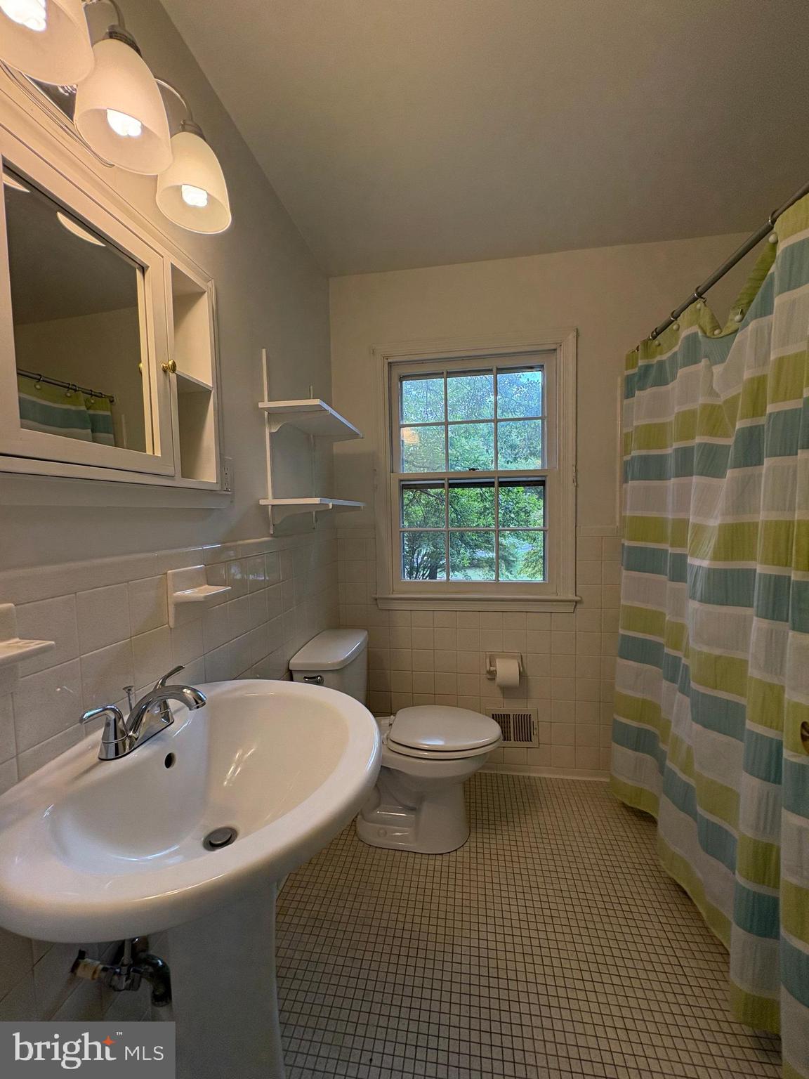3306 Whitesworth Road Phoenix, MD 21131 - Photo 23 of 31 a bathroom with a sink toilet and mirror