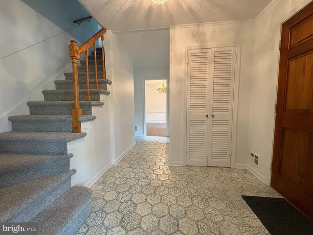 a view of an entryway with wooden floor and door