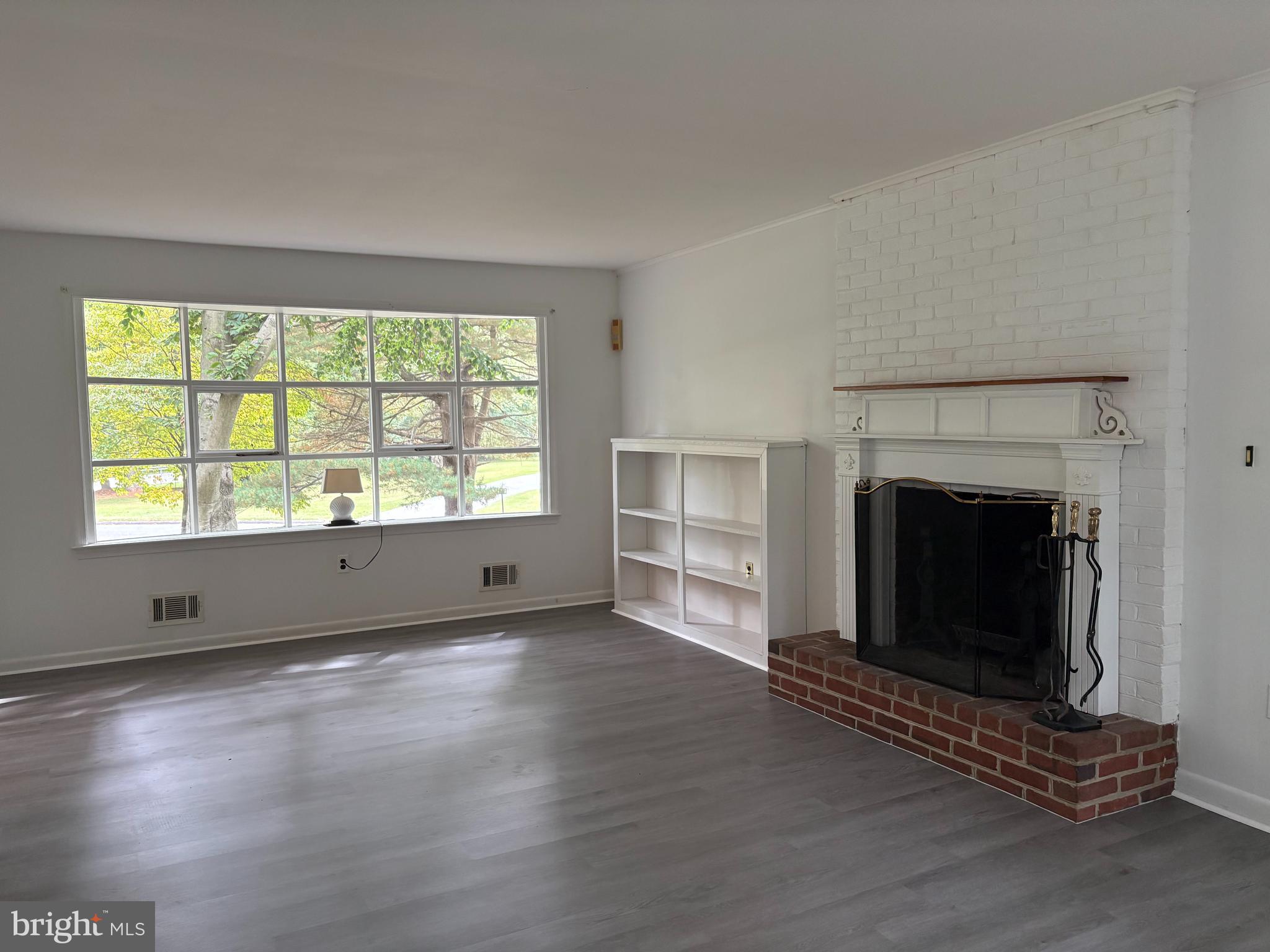 3306 Whitesworth Road Phoenix, MD 21131 - Photo 7 of 31 a view of an empty room with wooden floor and a window