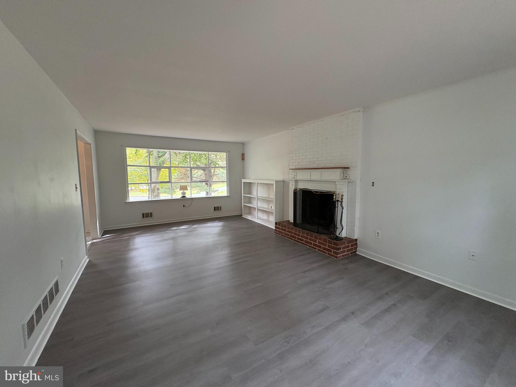 3306 Whitesworth Road Phoenix, MD 21131 - Photo 8 of 31 an empty room with wooden floor and a window
