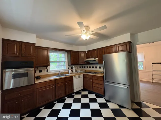 a kitchen with a refrigerator a sink and dishwasher