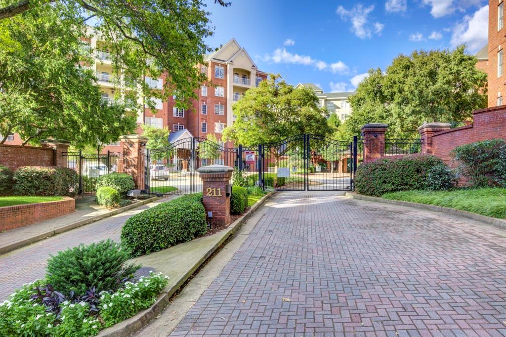 211 Colonial Homes Drive Northwest, Unit 1301 Atlanta, GA 30309 - Photo 1 of 50 a view of a street with a building in the background