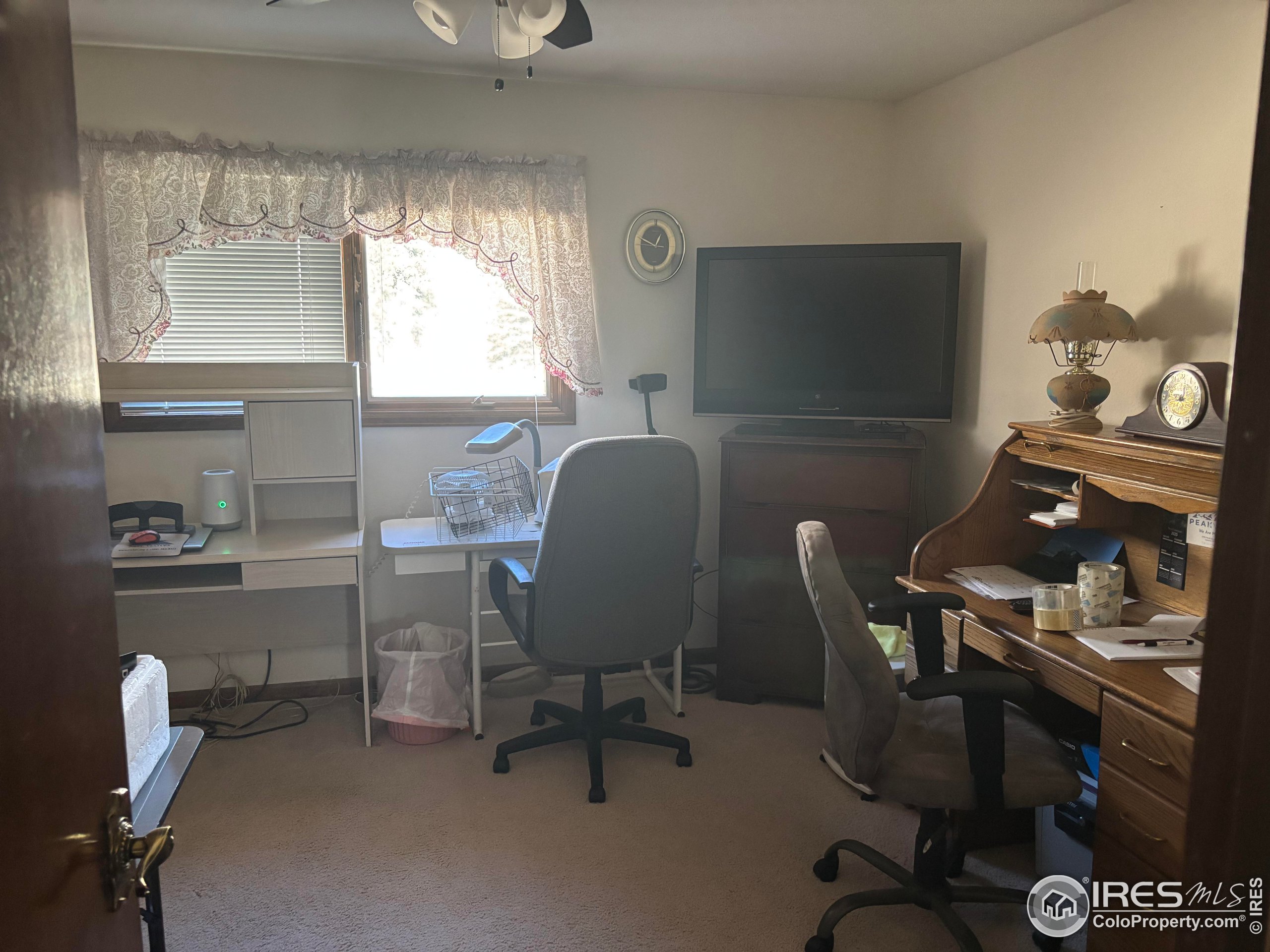 209 Crown Point Drive Bellvue, CO 80512 - Photo 16 of 16 a workspace with furniture and a window