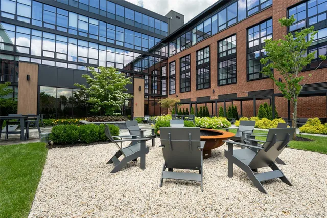 a view of a patio with a table and chairs