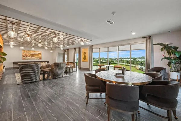 a dining room with furniture and wooden floor